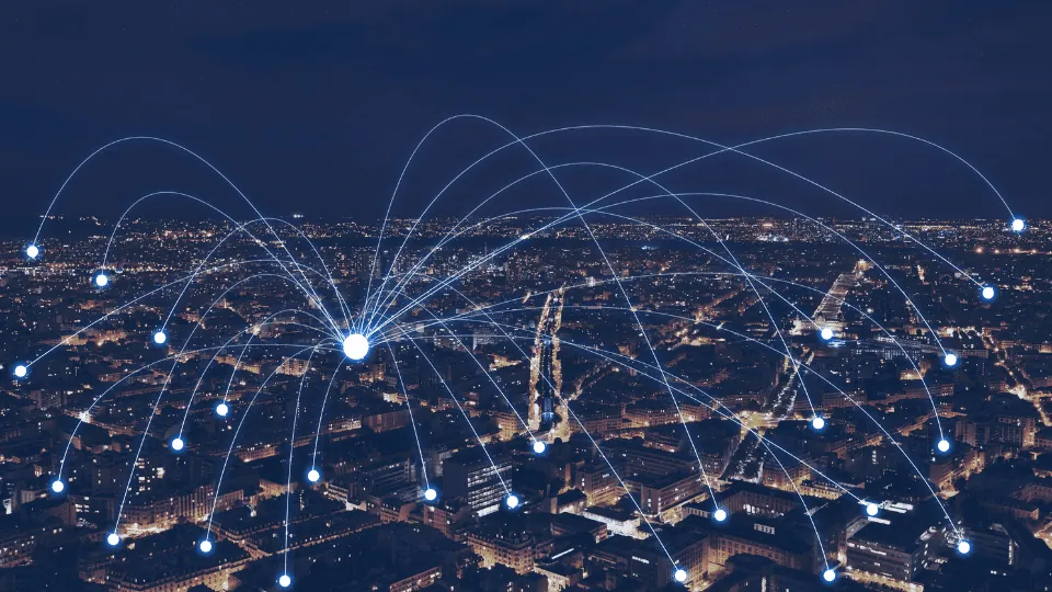 City at night with network lines linking points of light